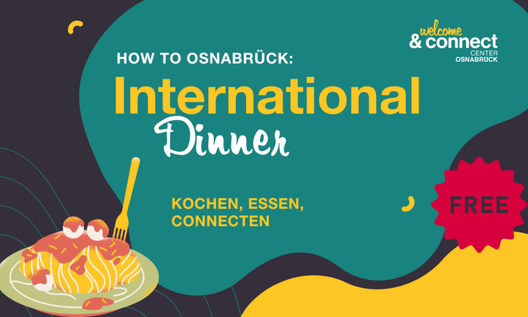 Gruppenfoto von 24 Personen auf einer Treppe vor einem historischen Gebäude.